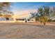 Stunning desert property showcasing a contemporary home at sunset at 29441 N 64Th St, Cave Creek, AZ 85331
