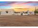 Modern Southwestern home with a gravel driveway and desert landscape at 29441 N 64Th St, Cave Creek, AZ 85331