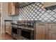 Modern kitchen with stainless steel appliances and custom cabinetry at 29441 N 64Th St, Cave Creek, AZ 85331