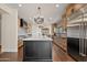 Open concept kitchen with large island and hardwood floors at 29441 N 64Th St, Cave Creek, AZ 85331