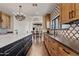 Open kitchen featuring a large island and breakfast bar at 29441 N 64Th St, Cave Creek, AZ 85331