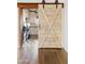 Laundry room with barn door and farmhouse sink at 29441 N 64Th St, Cave Creek, AZ 85331