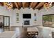Spacious living room with fireplace, high ceilings, and large windows at 29441 N 64Th St, Cave Creek, AZ 85331