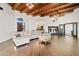 Open living room with sectional sofa and view into kitchen at 29441 N 64Th St, Cave Creek, AZ 85331