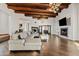 Large living room with sectional sofa, hardwood floors, and unique lighting at 29441 N 64Th St, Cave Creek, AZ 85331