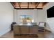 Home office with wood desk, comfortable chair, and large window at 29441 N 64Th St, Cave Creek, AZ 85331