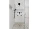 Walk-in shower with patterned tile, rain shower head, and body sprays at 29441 N 64Th St, Cave Creek, AZ 85331