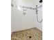 Walk-in shower with pebble stone floor and tiled walls at 29441 N 64Th St, Cave Creek, AZ 85331