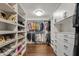 Large walk-in closet with ample shelving and hanging space at 29441 N 64Th St, Cave Creek, AZ 85331