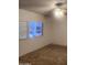 Bright bedroom with carpet and large window at 30188 N Gary Rd, Queen Creek, AZ 85142