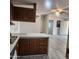 Kitchen boasts a breakfast bar and views into the living room at 30188 N Gary Rd, Queen Creek, AZ 85142