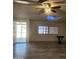 Living room with wood-look floors and access to patio at 30188 N Gary Rd, Queen Creek, AZ 85142