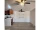 Bright living room with ceiling fan and wood-look flooring at 30188 N Gary Rd, Queen Creek, AZ 85142