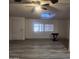 Living room with wood-look floors and access to patio at 30188 N Gary Rd, Queen Creek, AZ 85142