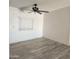 Living room features a ceiling fan and large window at 30188 N Gary Rd, Queen Creek, AZ 85142