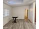 Living room with wood-look floors and hallway access at 30188 N Gary Rd, Queen Creek, AZ 85142