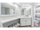 Modern bathroom featuring a white vanity, spacious countertop, and a separate shower at 4200 N Miller Rd # 309, Scottsdale, AZ 85251