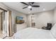 Main bedroom with large TV, dresser and access to bathroom at 4200 N Miller Rd # 309, Scottsdale, AZ 85251