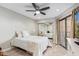 Bright bedroom with ceiling fan and access to balcony at 4200 N Miller Rd # 309, Scottsdale, AZ 85251