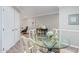 Small dining area with glass table and white chairs near kitchen at 4200 N Miller Rd # 309, Scottsdale, AZ 85251