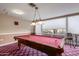 Well-lit game room with a pool table and comfortable seating at 4200 N Miller Rd # 309, Scottsdale, AZ 85251