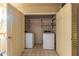 Convenient laundry room with washer, dryer, and extra storage shelves at 4200 N Miller Rd # 309, Scottsdale, AZ 85251