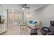 Relaxing living room with patio access and plantation shutters at 4200 N Miller Rd # 309, Scottsdale, AZ 85251
