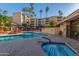Refreshing community pool and spa, surrounded by lush landscaping at 4200 N Miller Rd # 309, Scottsdale, AZ 85251