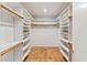 Large walk-in closet with ample shelving and hanging space at 4531 E Quartz Mountain Rd, Paradise Valley, AZ 85253