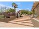 Multi-level stone patio with elevated deck, offering multiple seating areas at 4531 E Quartz Mountain Rd, Paradise Valley, AZ 85253