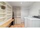 Laundry room with washer, dryer, shelving and counter space at 4531 E Quartz Mountain Rd, Paradise Valley, AZ 85253