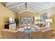 Bright living room with vaulted ceilings, comfy seating and access to backyard at 4531 E Quartz Mountain Rd, Paradise Valley, AZ 85253