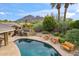 Relaxing kidney-shaped pool with mountain views at 4531 E Quartz Mountain Rd, Paradise Valley, AZ 85253