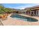 Freeform pool with flagstone decking and mountain views at 4531 E Quartz Mountain Rd, Paradise Valley, AZ 85253