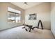 Bright bedroom with large window and home gym setup at 8300 E Dixileta Dr # 281, Scottsdale, AZ 85266