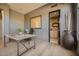 Home office features built-in wine storage and hardwood floors at 8300 E Dixileta Dr # 281, Scottsdale, AZ 85266