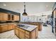 Spacious kitchen with large island, breakfast bar, and views of the backyard at 8300 E Dixileta Dr # 281, Scottsdale, AZ 85266