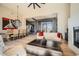 Open concept living area with hardwood floors, a fireplace, and large windows at 8300 E Dixileta Dr # 281, Scottsdale, AZ 85266