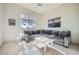 Living room with comfy sectional sofa and large window at 8300 E Dixileta Dr # 281, Scottsdale, AZ 85266