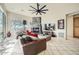 Comfortable living room featuring a fireplace, large TV, and leather furniture at 8300 E Dixileta Dr # 281, Scottsdale, AZ 85266