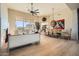 Spacious living room with hardwood floors, fireplace, and large windows at 8300 E Dixileta Dr # 281, Scottsdale, AZ 85266