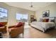 Spacious main bedroom with access to a private patio and hardwood floors at 8300 E Dixileta Dr # 281, Scottsdale, AZ 85266