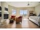 Main bedroom with fireplace, access to patio and pool views at 8300 E Dixileta Dr # 281, Scottsdale, AZ 85266