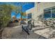 Charming patio with fireplace and seating area at 8300 E Dixileta Dr # 281, Scottsdale, AZ 85266