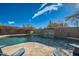 Large pool with a waterfall feature and flagstone deck at 8300 E Dixileta Dr # 281, Scottsdale, AZ 85266