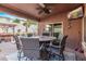 Covered patio with wicker furniture and ceiling fan at 10746 W Desert Elm Ln, Peoria, AZ 85383