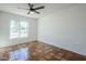 Bright bedroom with tile floors and large window at 12058 N 92Nd Pl, Scottsdale, AZ 85260