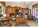 Bright home office with built-in wooden desk and cabinets at 1318 W Medinah Ct, Anthem, AZ 85086