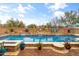 Resort-style pool and spa with a stone water feature in a desert landscape at 1318 W Medinah Ct, Anthem, AZ 85086