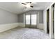 Spacious bedroom with ceiling fan and ample closet space at 17200 W Bell Rd # 1731, Surprise, AZ 85374